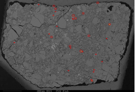 Phosphate grains in a diogenite meteorite.